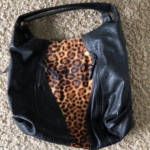 Black and animal skin handbag